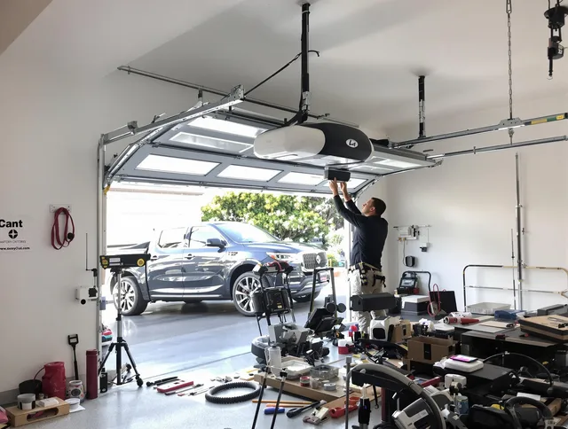Horizon West Garage Door Repair specialist installing smart garage door opener system in Horizon West home